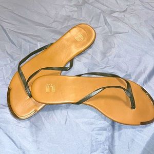 Sage green, brown flip flops with gold around top. Really good condition.
